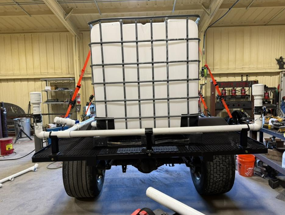 Custom trailer build with mounted water tote and plumbing